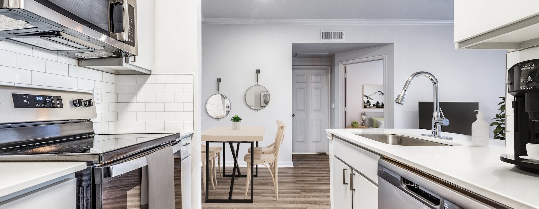a kitchen with white cabinets