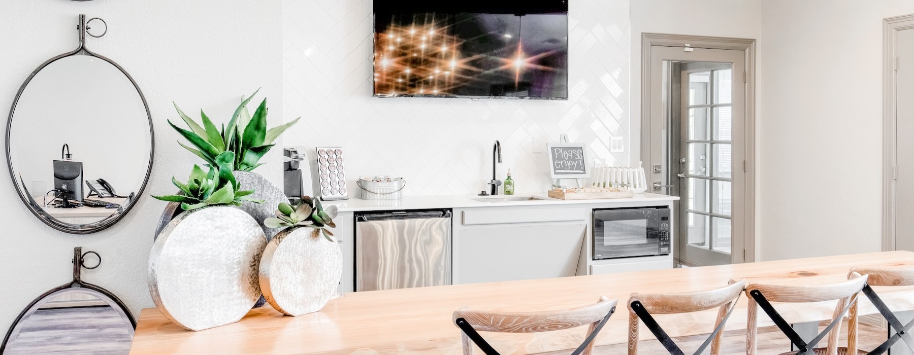 a community kitchen with a dining table