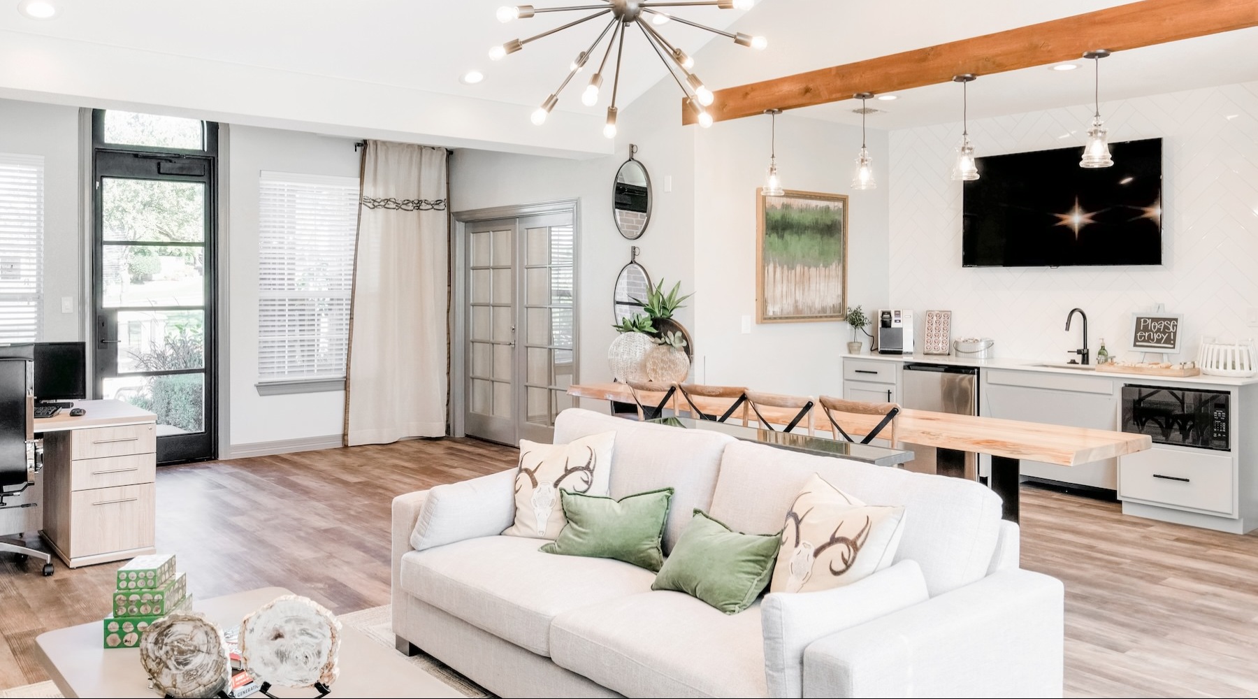 a clubroom with a couch and a tv