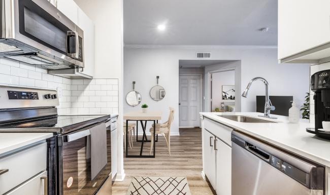 a kitchen with white cabinets