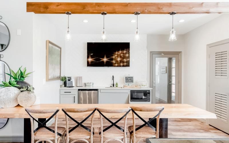 a community kitchen with a dining table