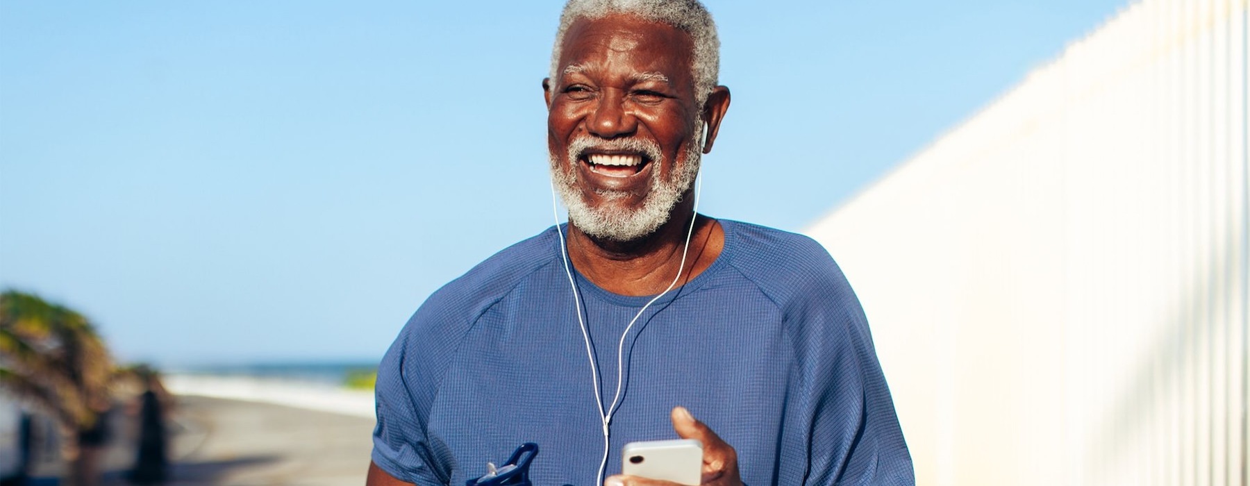 a man holding a water bottle while outdoors