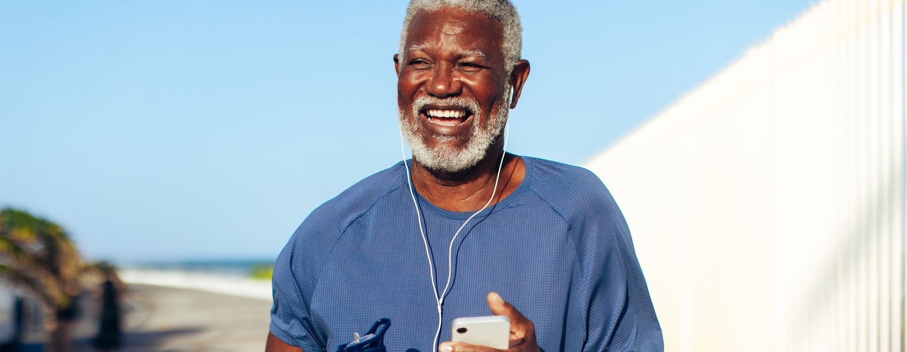 a man holding a water bottle while outdoors