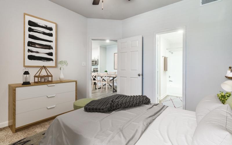 a bedroom with a bed and a table